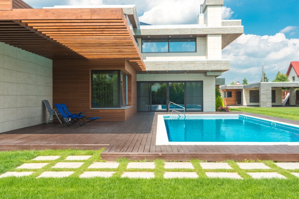 Contemporary villa featuring a swimming pool and elegant patio design, ideal for luxury living.